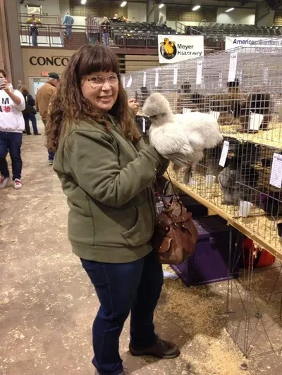 Bobbi holding a Silkie chicken at the Ohio National poultry show